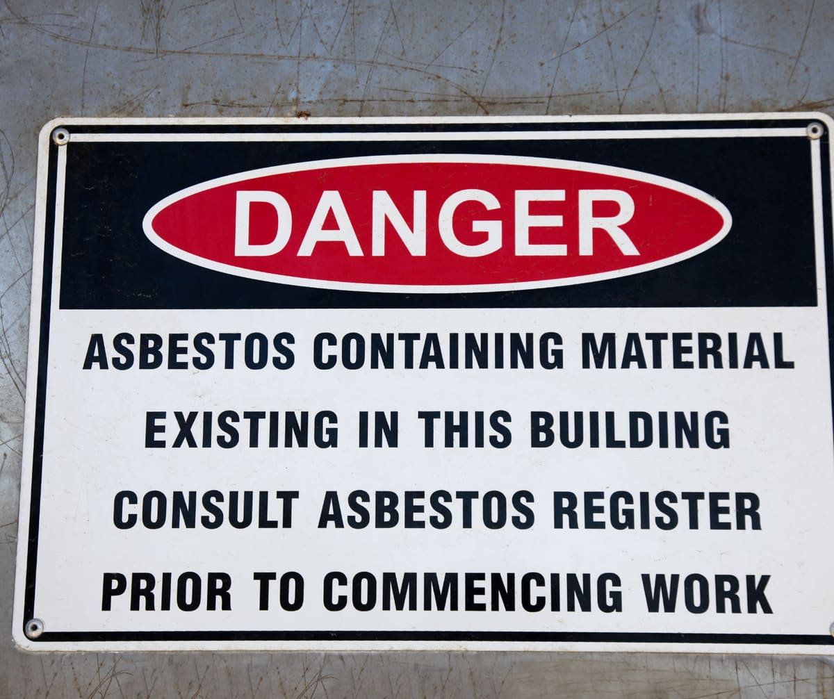 Asbestos register warning sign in a commercial building