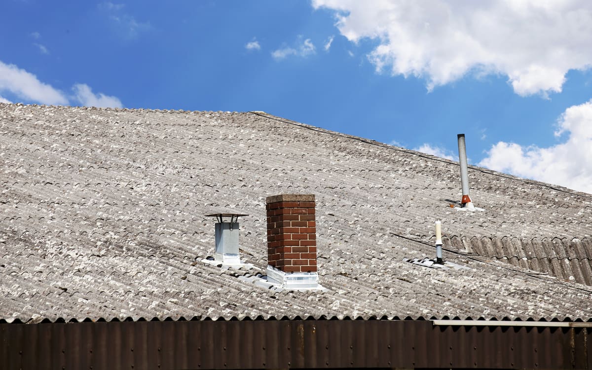 Illustration of an older house roof that may contain asbestos