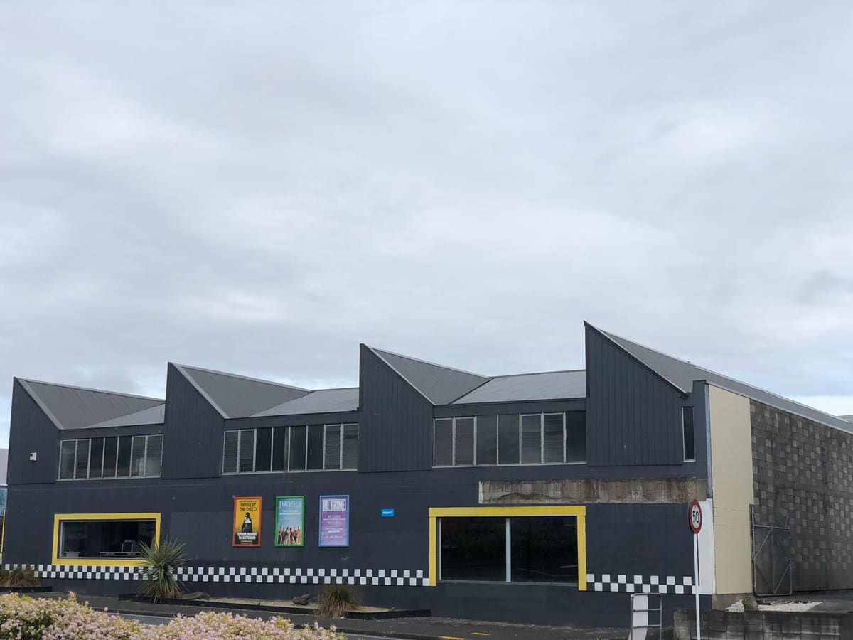 Auckland commercial building after its asbestos roof was replaced with new long-run roofing