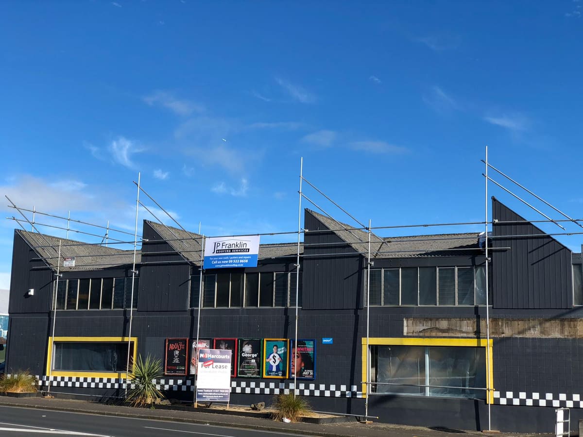 Commercial building with asbestos roof before