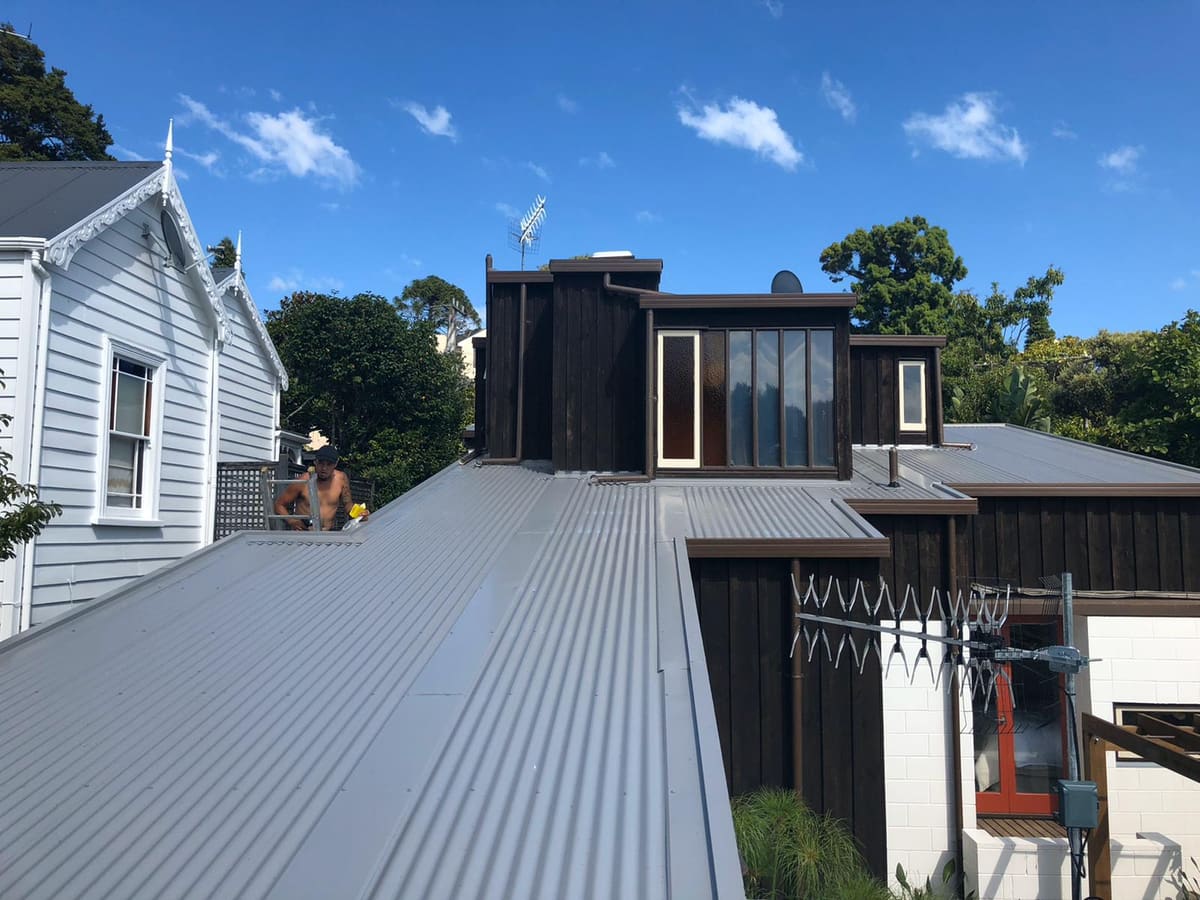 Brand-new long-run roof on an Auckland home after its Super Six asbestos roof was removed