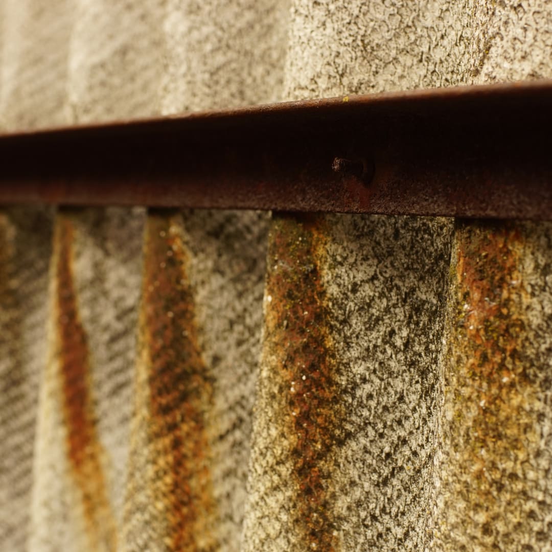 Weathered asbestos cement fence panel